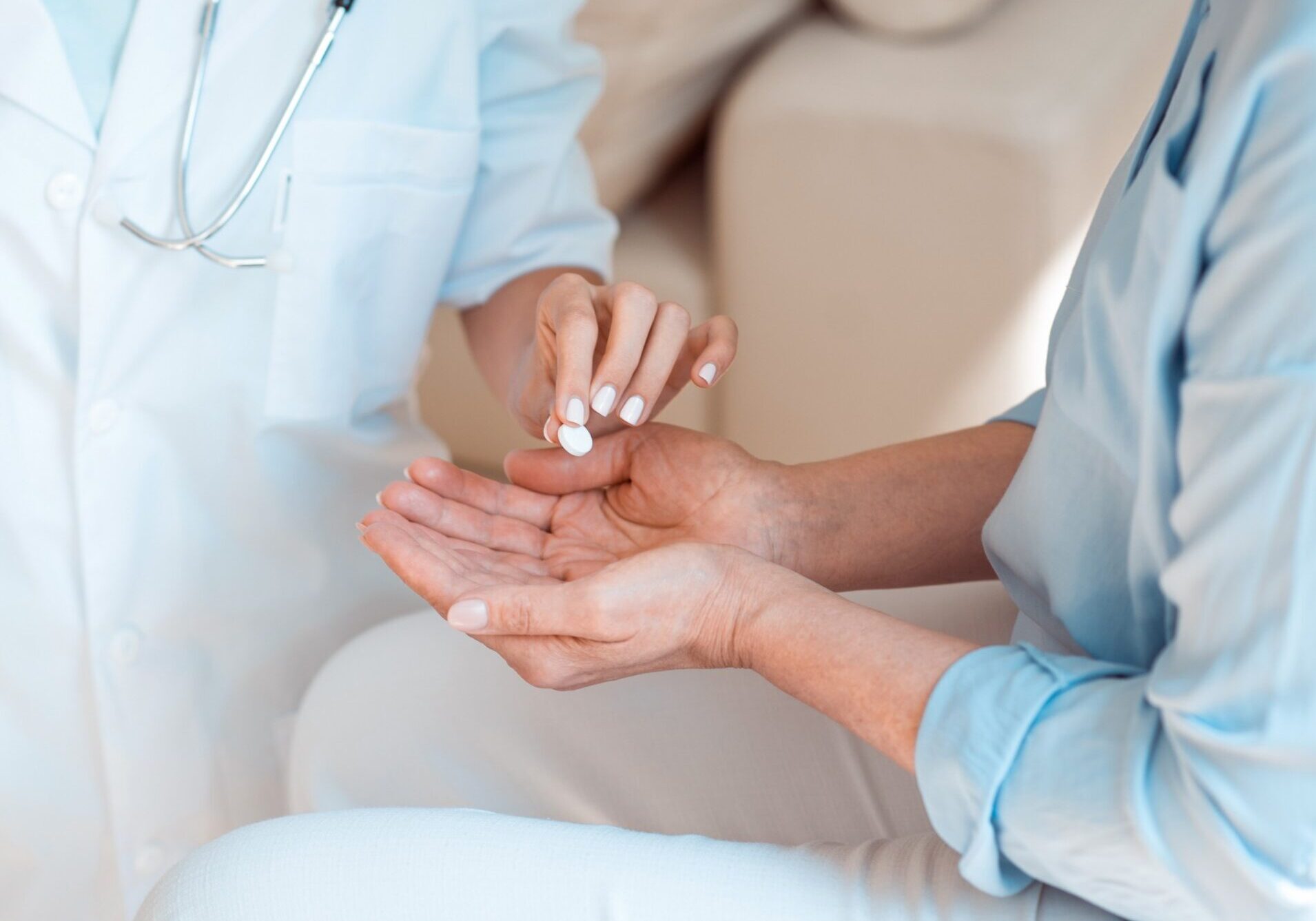 Cropped Pill Image Doctor gives female patient in a long term care facility a pill